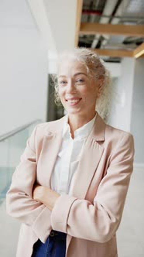 Confident Professional Woman Smiling in Modern Office