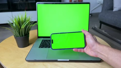 Green Screen Smartphone and Laptop Display in Cozy Workspace