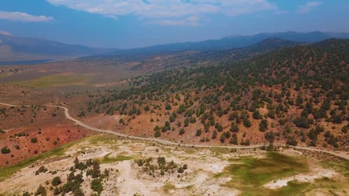 Amazing scenery of rocky landscape covered with little green bushes on tops.