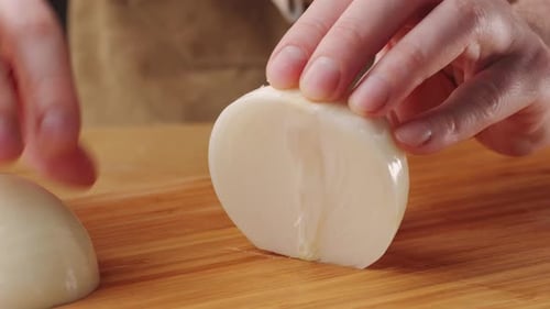 Chef Chopping a Red Onion with a Knife on the Cutting Board Macro Close Up of Cutting Red Onion on