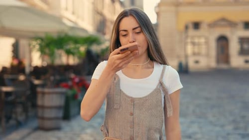 Young Woman Using Voice Command on Phone