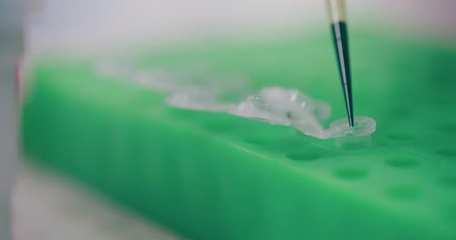 Liquid Sample Being Injected into Tube for Science