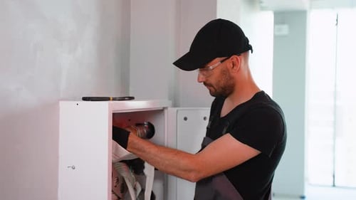 Firefighter Specialist Installs or Inspects Fire Hydrant in Office