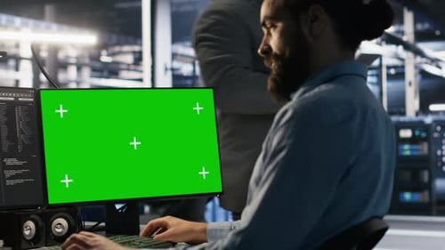 Close Up of Server Farm System Administrator Using Green Screen PC