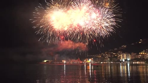 Fireworks with Colorful Lights Over Sea