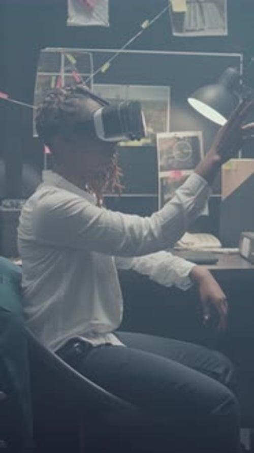 Young Adult Using Virtual Reality Headset in Office