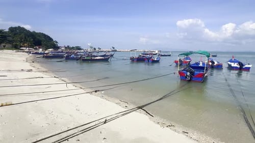Fishing Boats on the Sea and Beach of George Town City in the Distance on the Strait of Malacca in