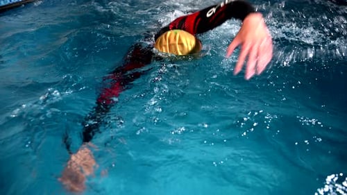 Underwater View of Professional Swimmer Training in Swimming Pool 120 Fps Super Slow Motion Raw