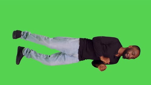Vertical Video Side View of Joyful Smiling Man Doing Dance Moves Acting Funny