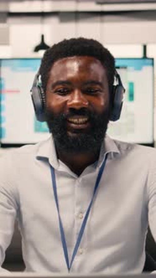 Vertical Video Relaxed Businessman Enjoying Music Short Break at Office Wireless Headset