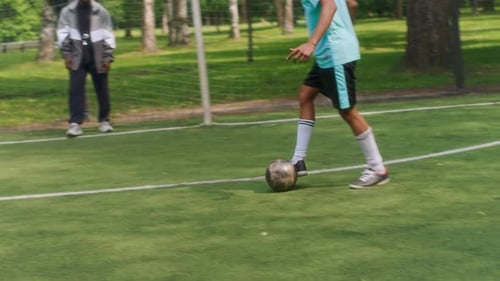 Focused Soccer Training with Teens Practicing Shots and Passes