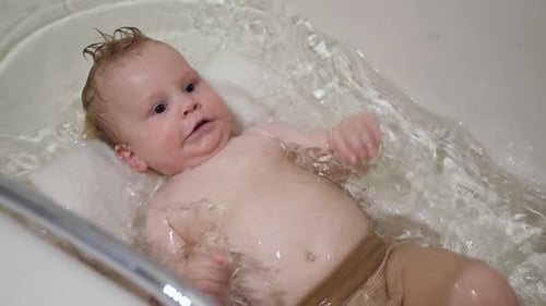 Infant enjoying bath time
