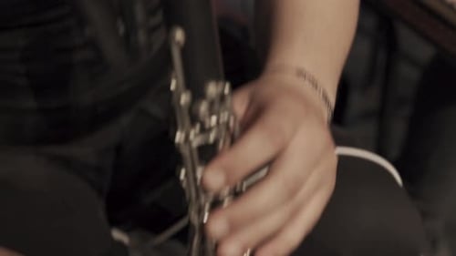 fingers playing clarinet