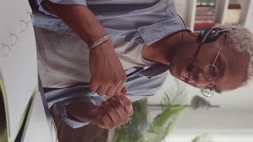 Man Wearing Headset Working From Home