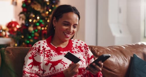 Woman Shops Online at Home for Christmas Gifts