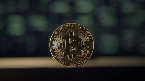 Bitcoin Coin with Digital Numbers Backdrop