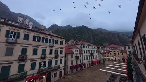 Timelapse of Historic Square With Mountain Backdrop