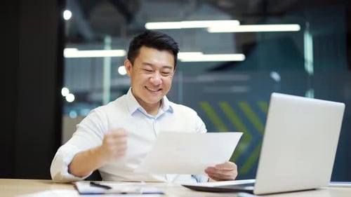 Cheerful Man Working in Modern Office