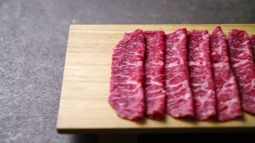 fresh beef raw sliced with marbled texture served for Sukiyaki and Shabu or Yakiniku