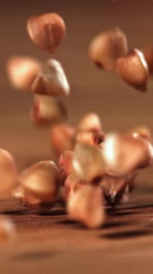 Buckwheat Falls on a Wooden Table Filmed on a Highspeed Camera at 1000 Fps