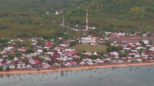 A Scenic Coastal Village Nestled Between Lush Greenery And Sea