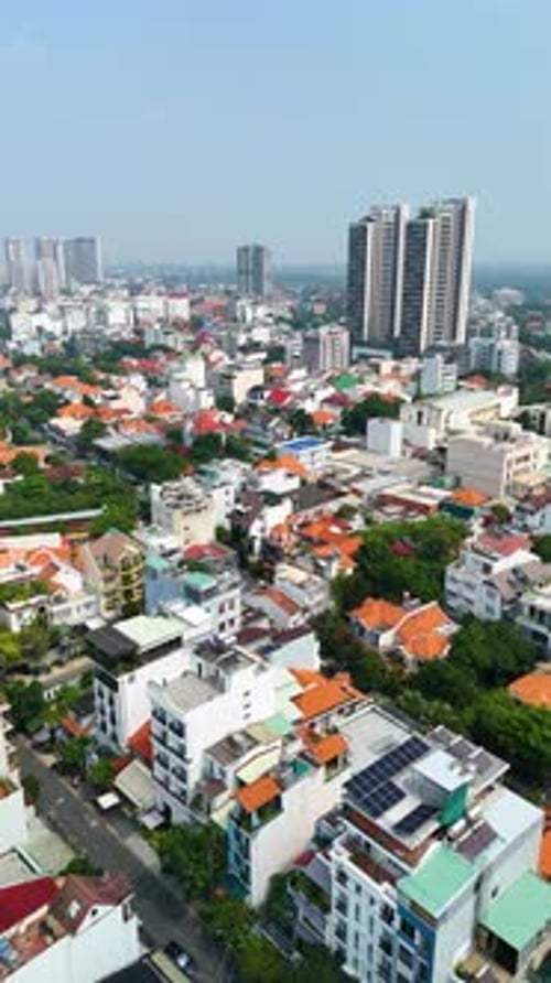 Vertical expansive aerial view of a residential district in Ho Chi Minh City, Vietnam, showcasing a