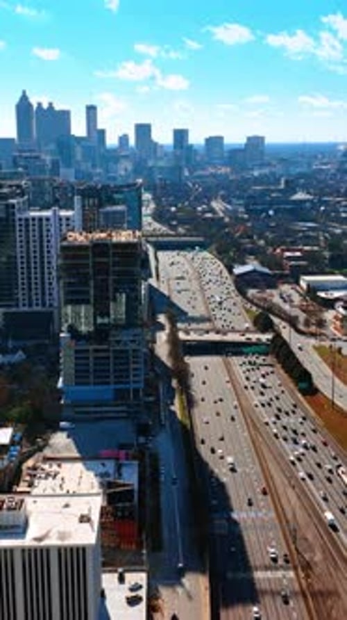 Multiple cars travel by the wide multi-lane roads of Atlanta, Georgia, USA.