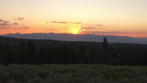 Mountain Peaks With Glowing Golden Evening Light At Sunset In Summertime. Timelapse
