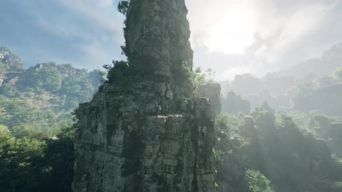 A Majestic Rock Formation Towering Over a Lush Forest in China