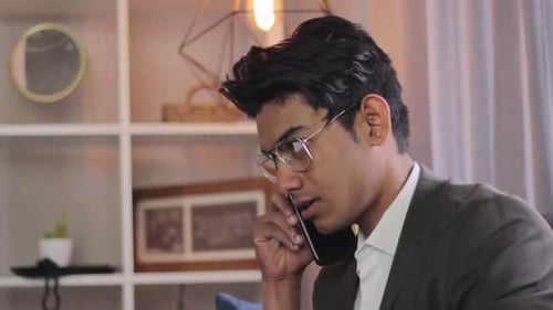 Young Adult on Phone Call Indoors