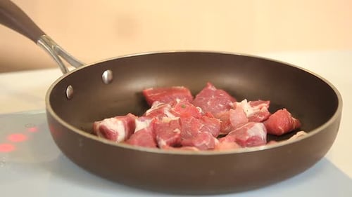 Frying Pork Cubes on Teflon Frying Pan