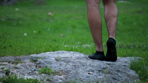 Adult Male Standing on Rock Outdoors
