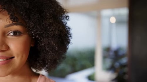 Smiling woman with curly hair enjoying her day, close-up portrait, copy space
