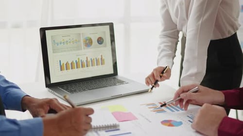 Close up of business hands are working and brainstorming on paperworks.