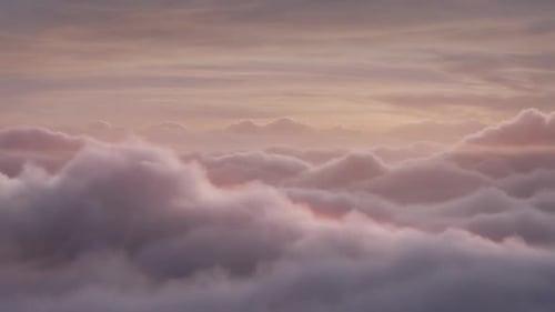 Atmospheric Clouds Floating Under a Vibrant Sunset Sky
