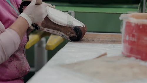 Woman Assembling Shoe in Factory Close Up Shot