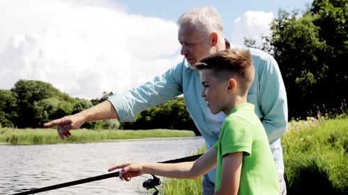 Family, Generation, Summer Holidays and People Concept - Happy Grandfather and Grandson