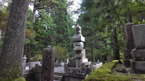 Traditional Japanese Temple Bell in Cemetery at Mount Koya During Autumn