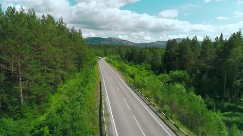 Top View of Truck Driving Along Highway on Summer Day Scene White Truck is Driving on Country