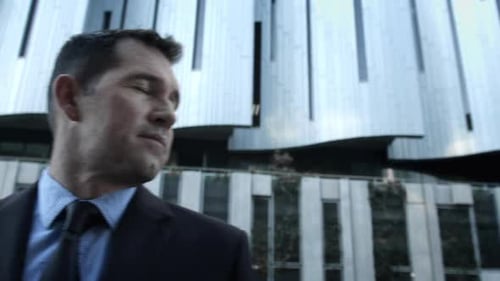 Suits Business Man Fixing His Tie Before a Deal in the City