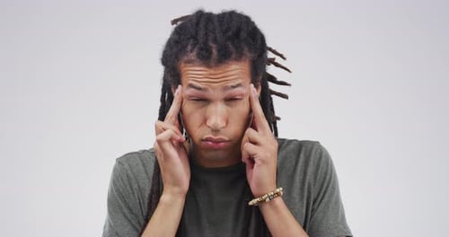 Man Massaging Temples in Distress Close Up