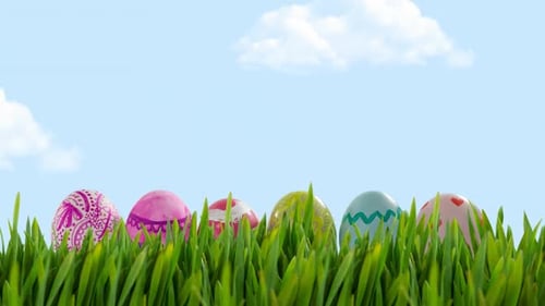 Colorful Easter Eggs in Green Grass with Moving Clouds Background