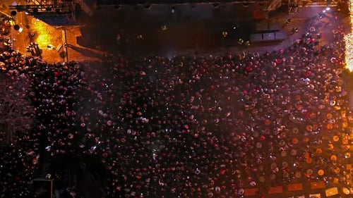 Aerial View of Large Crowd at Nighttime Event