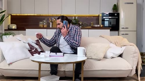 Adult Man Checking Bills Managing Finances Talking Phone Indoors