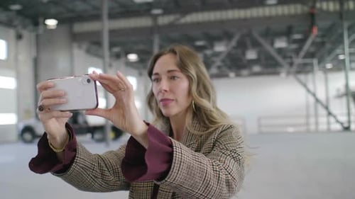 Female Inspector at Empty Warehouse