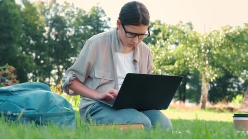 Teenage Schoolgirl Studying Reading Her Books Tablet and Notebook Sitting Outdoors Back to School