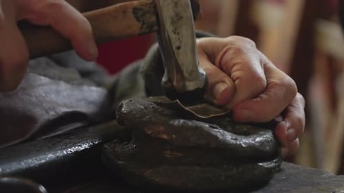 Senior Elderly Master Jeweler in Wheelchair Works in a Workshop