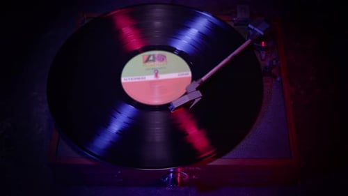 Vinyl Record player Spinning with cinematic red and blue lighting