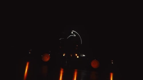 Dramatic vintage car reveal in dark garage with glowing lights video