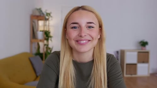 Young Woman Smiles Directly at Camera